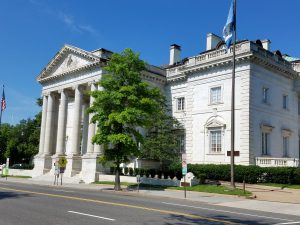 Image of the front of a white building with columns, the entrance to the DAR headquarters in Washington DC