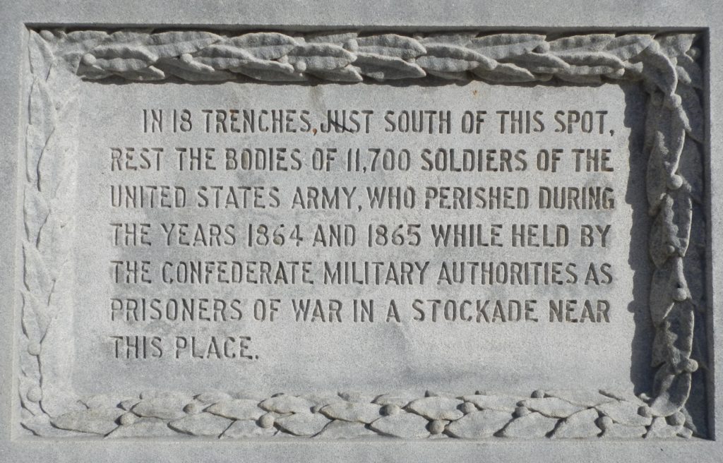In 18 trenches, just south of this spot, rest the bodies of 11,700 soldiers of the united states army, who perished during the years 1864 and 1865 while held by the confederate military authorities as prisoners of war in a stockade near this place.